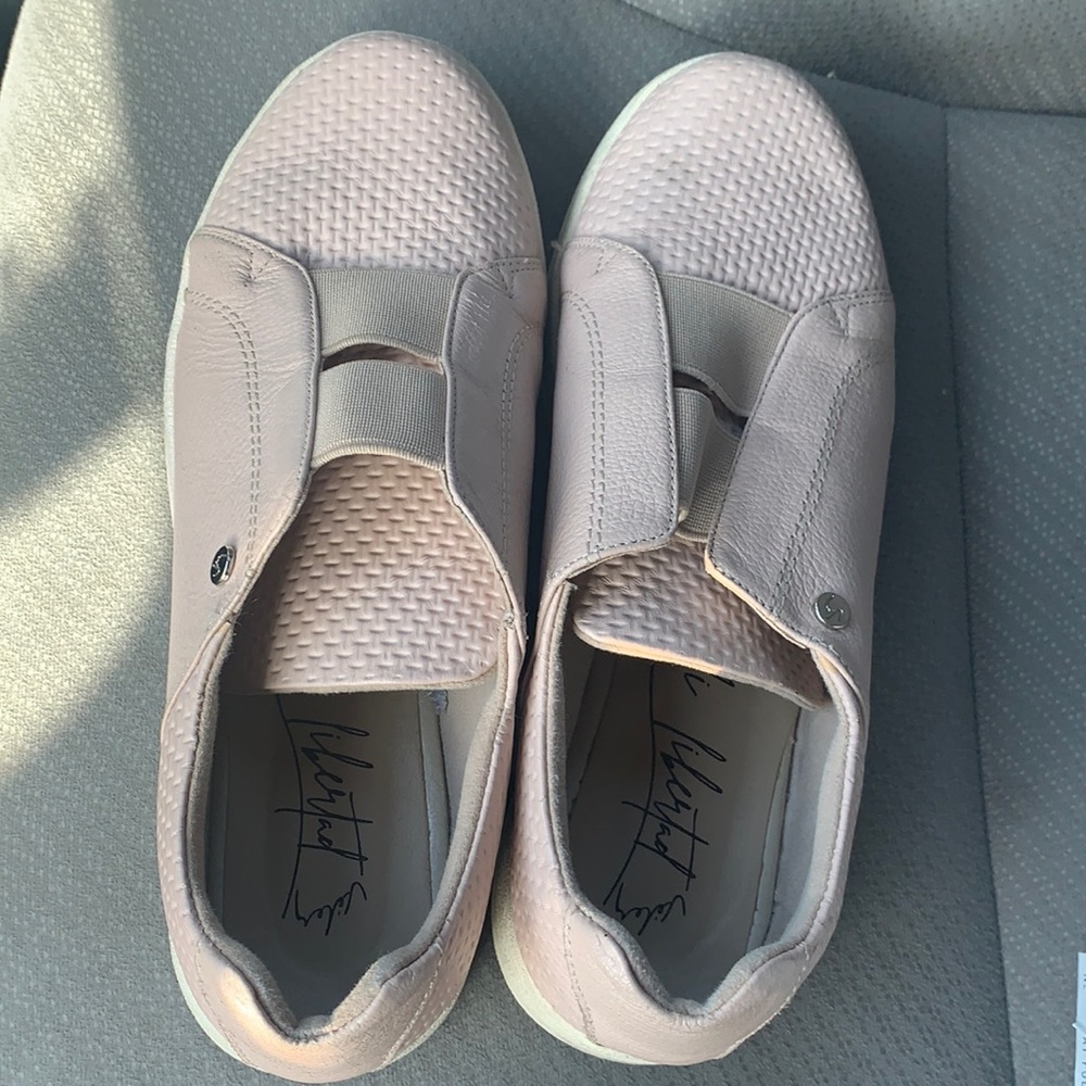 Velez pink slip on sneakers.